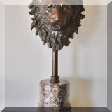 D30. Bronze lion head with marble base. 